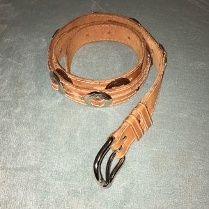 Light tan leather belt with silver hardware